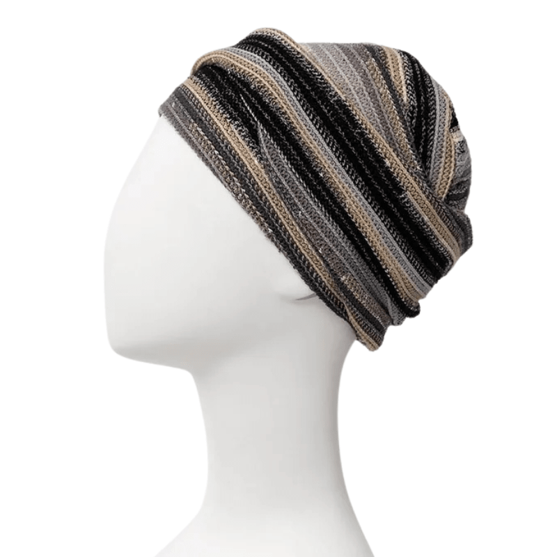 Turban Zoya motif Black Autumn Stripes avec bandeau intégré sur mannequin blanc, vue de côté gauche