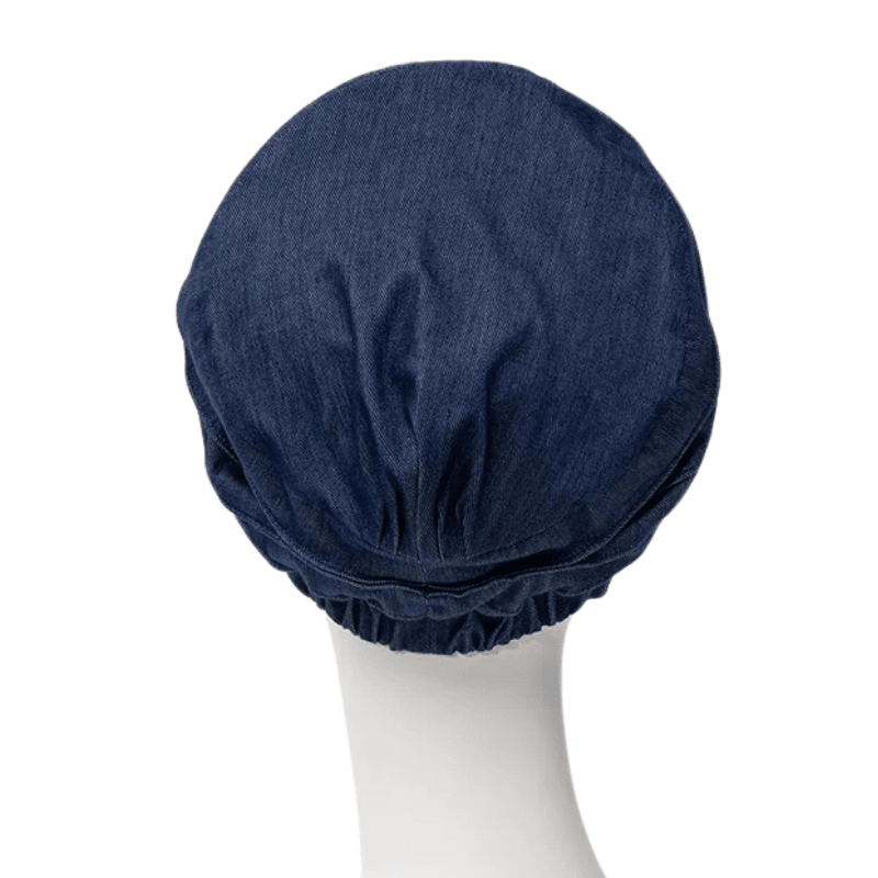 Dos du turban Yoga Christine Headwear bleu foncé en denim sur mannequin, avec bord froncé