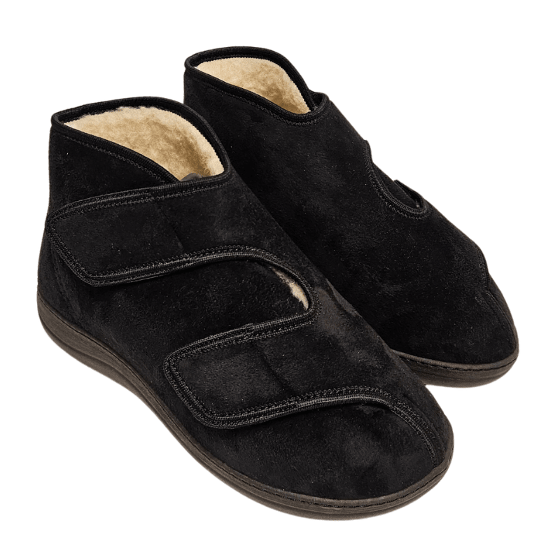 Une paire de chaussures de thérapie noires avec sangles velcro et un aperçu de la doublure en laine claire