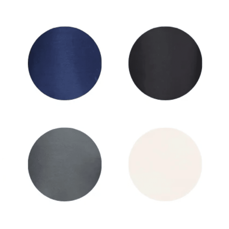 Quatre échantillons de couleur ronds montrant les couleurs disponibles du coussin lombaire : bleu, noir, gris et beige clair