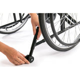 Roues anti-basculement pour fauteuil roulant standard
